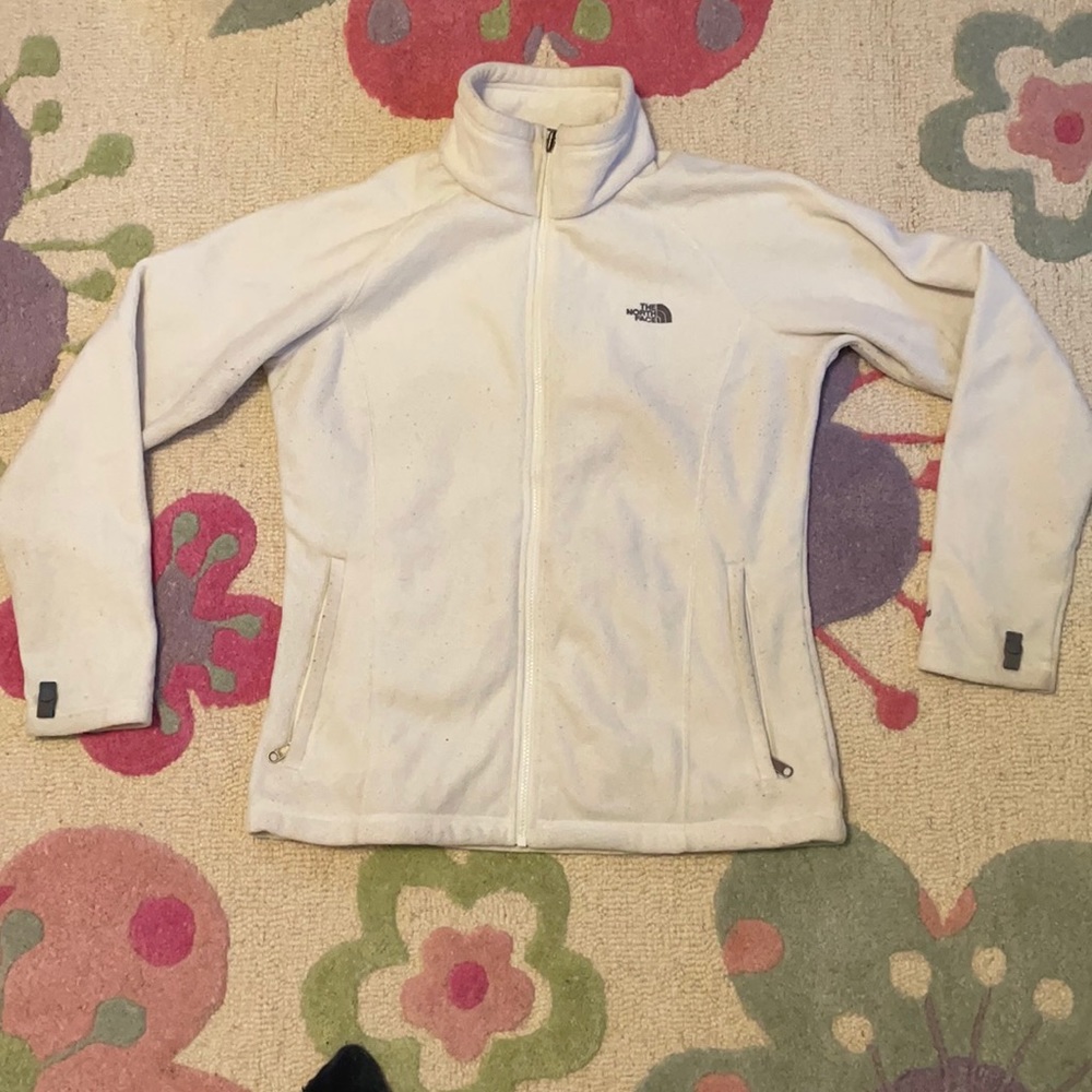 Used north face fleece. Does shows signs of wear.